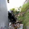 Video & Photos: Car Plunges Over Wall