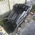 Photos: Unoccupied Car Crashes Through Wall