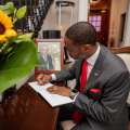 Premier David Burt Signs Condolence Book