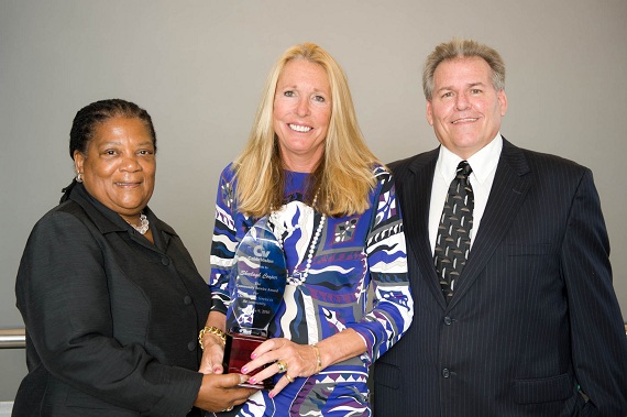  From left: Minister Neletha Butterfield, Sheelagh Cooper, and  CableVision's Terry Roberson