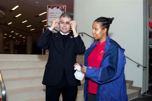 Minister De Silva adjusting glasses