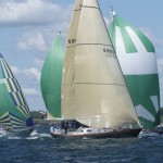 2012 Newport Bermuda Yacht Race -start in Narragansett Bay. Cetacea, a Hinckley SW 59 cruising yacht, holding her own against spinnaker flying rivals in Class 12