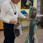 Judie Clee with art made from plastic marine debris