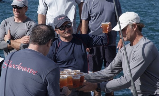 2014 Newport Bermuda Race. George Sakellaris, owner of the first to finish yacht Shockwave celebrates with  Gosling's Dark 'n Stormy drink with his crew on arrival at the Royal Bermuda YC dock. Shockwave crossed the St David's Lighthouse finish line to take line honours 7 minutes ahead of rival mini maxi Bella Mente with a time of  2days 15 hours 24 mins, 11 secs.