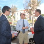 Premier and Minister for National Security Michael Dunkley and Senator Jeff Baron selling poppies on Parliament Street