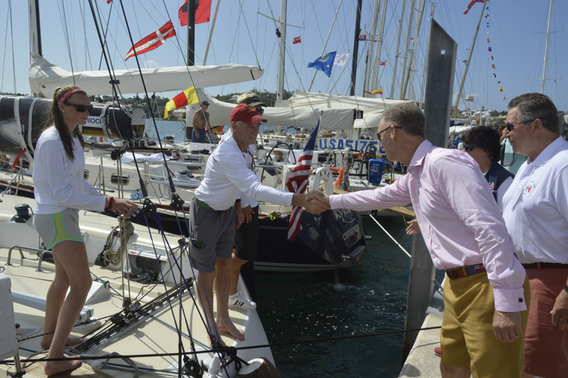2016 Newport Bermuda Yacht Race. Governor General's tour of the Bermuda Race yachts moored at the RBYC. His Excellency, the Governor of Bermuda, George Fergusson meeting Peter Becker, skipper of HIGH NOON, and his daughter Carina.