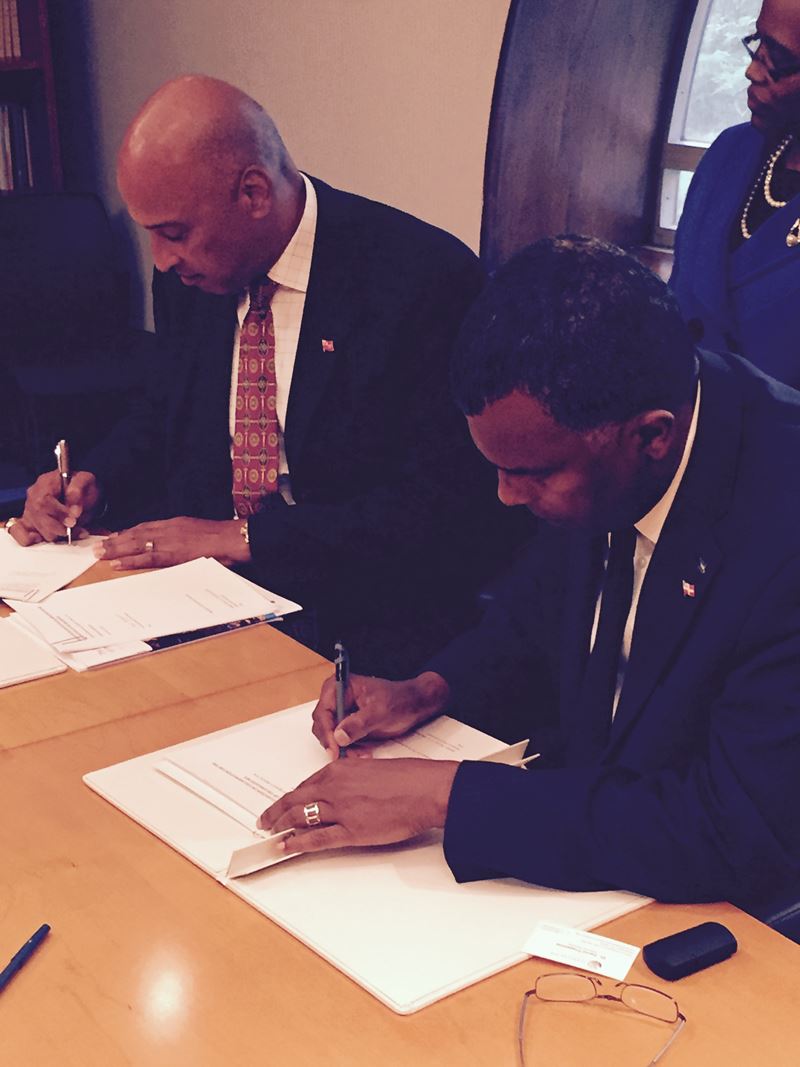 Minister Mitchell of The Bahamas signs the Hamilton Declaration