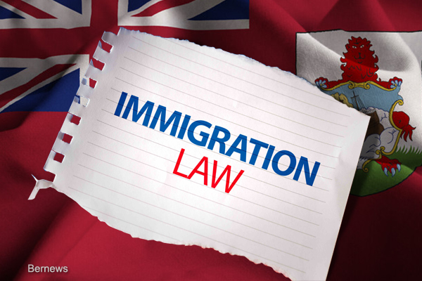 Immigration Law on notepaper and the US flag