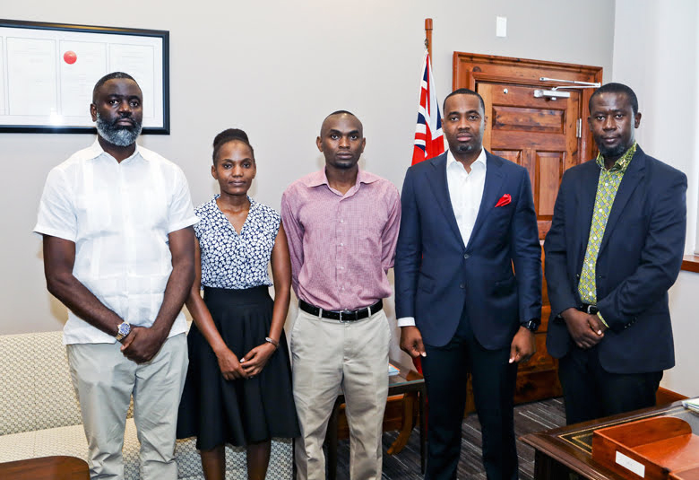Paul and sister Leah with Premier David Burt and Minister Wayne Caines